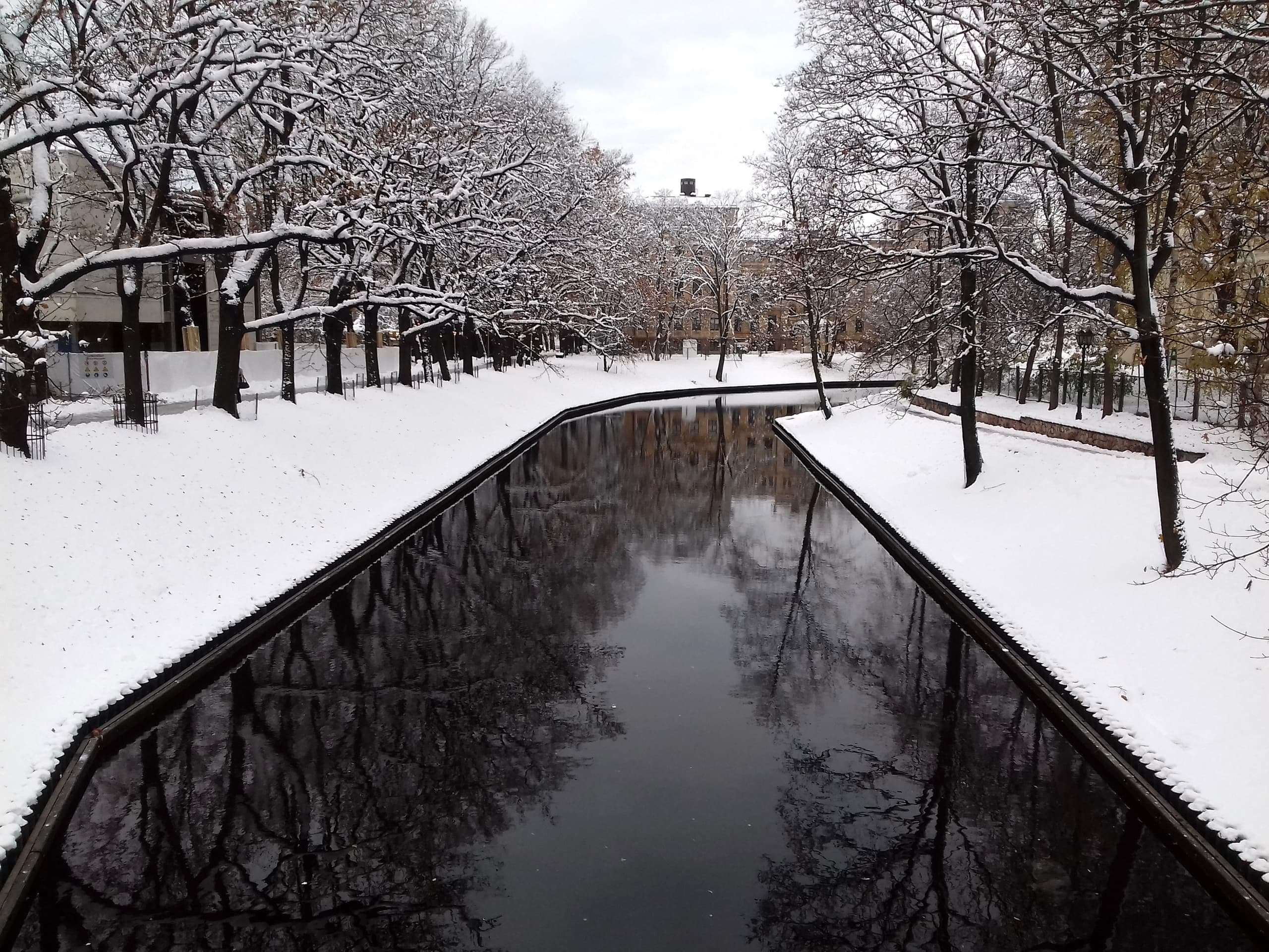 Riga's City Canal winding through parkland beside the Old Town